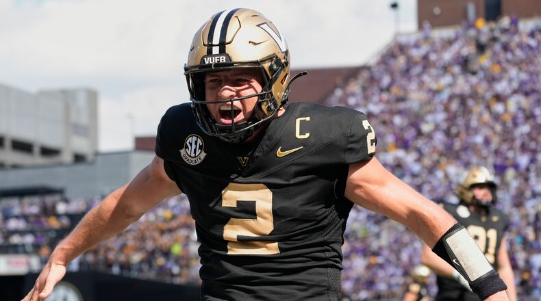 FILE - Vanderbilt quarterback Diego Pavia (2) celebrates a touchdown during the second half of an NCAA college football game against LSU, Saturday, Oct. 18, 2025, in Nashville, Tenn. (AP Photo/George Walker IV, File)