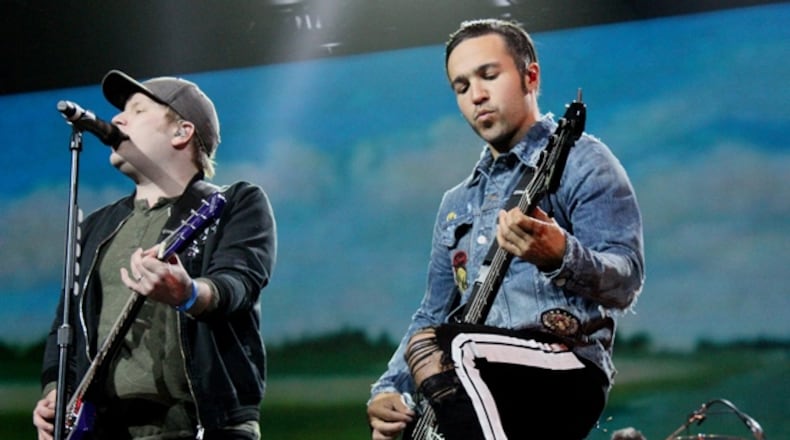 Patrick Stump and Pete Wentz share a moment at Philips Arena on Nov. 4, 2017. Photo: Melissa Ruggieri/AJC