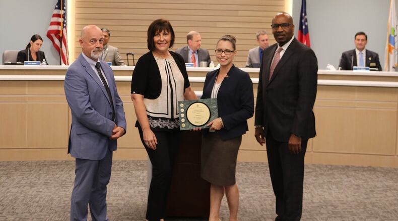 The Government Finance Officers Association recently recognized Johns Creek with the GFOA’s Distinguished Budget Presentation Award for its Fiscal Year 2022 budget. Pictured with the award (from left): Johns Creek Manager Ed Densmore, Payroll-Financial Analyst Joni Vierra, External Communications Manager Edie Damann, and Finance Director Ronnie Campbell. (Courtesy City of Johns Creek)