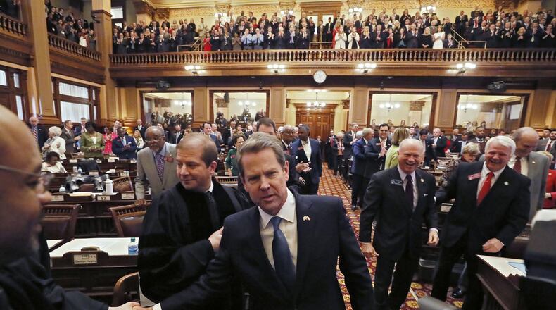 Gov. Brian Kemp is greeted by General Assembly and court members as he enters the House chamber on Thursday, Jan. 17, 2019. Kemp delivered his first State of the State address and released his first budget. BOB ANDRES / BANDRES@AJC.COM