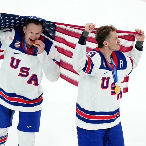 FILE - United States' Brady Tkachuk (7) and Matthew Tkachuk (19) celebrate after the United States' win over Canada in the men's ice hockey gold medal game at the 2026 Winter Olympics in Milan, Italy, Feb. 22, 2026. (AP Photo/Carolyn Kaster, File)
