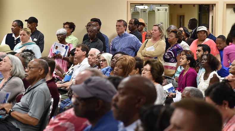 Hundreds of DeKalb County residents filled the Maloof Auditorium to a standing room only capacity on Oct. 6, seeking answers to high water bills. BRANT SANDERLIN/BSANDERLIN@AJC.COM