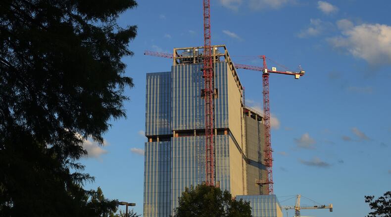 The State Farm tower rises along Hammond Drive in Dunwoody. State Farm was seeking a total of $48.6 million in tax incentives for three office towers, but it withdrew a request for $15 million of that amount that would have helped offset costs of construction of the first tower that’s nearly completed. KENT D. JOHNSON/kdjohnson@ajc.com