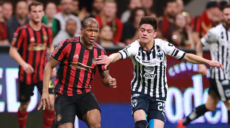 Atlanta United midfielder Darlington Nagbe, the man on the match, works the ball against Monterrey defender Jonathan Gonzalez in a Concacaf Champions league quarterfinal match on Wednesday, March 13, 2019, in Atlanta. Curtis Compton/ccompton@ajc.com