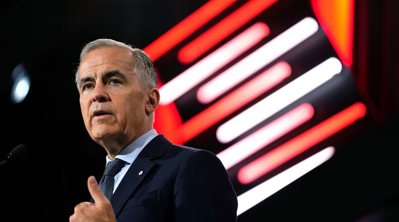 Canadian Prime Minister Mark Carney makes an address at the Canadian Association of Defense and Security Industries annual defense industry trade show CANSEC, in Ottawa, on Wednesday, May 27, 2026. (Justin Tang/The Canadian Press via AP)