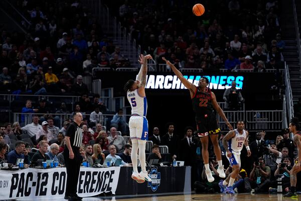 Florida guard Will Richard (5) shoots against Maryland forward Jordan Geronimo (22) during the second half in the Sweet 16 of the NCAA college basketball tournament, Thursday, March 27, 2025, in San Francisco. (AP Photo/Godofredo A. Vásquez)