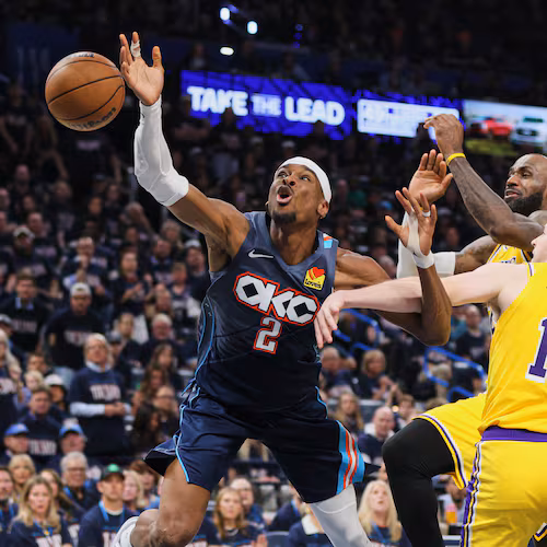 Oklahoma City Thunder's Shai Gilgeous-Alexander (2) is fouled driving to the basket by Los Angeles Lakers' Austin Reaves (15) as LeBron James, right rear, follows behind on the play in the second half of Game 2 in a second-round NBA basketball playoffs series Thursday, May 7, 2026, in Oklahoma City. (AP Photo/Nate Billings)