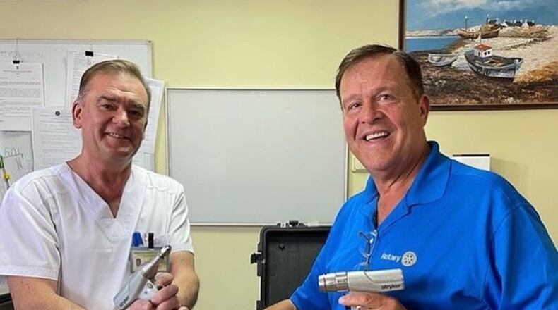 Emory Morsberger (right) delivered three Stryker drills to a hospital in Kyiv.