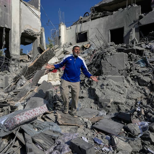 A man reacts on the rubble of a destroyed home that was hit by an Israeli airstrike in Ansar village, southern Lebanon, Saturday, Aug. 15, 2026. (AP Photo/Mohammed Zaatari)