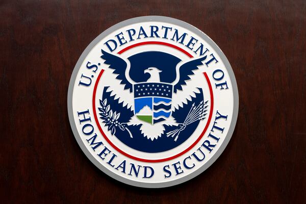 The Department of Homeland Security seal is seen on the podium at the Immigration and Customs Enforcement headquarters, Wednesday, April 9, 2025, in Washington. (AP Photo/Alex Brandon)