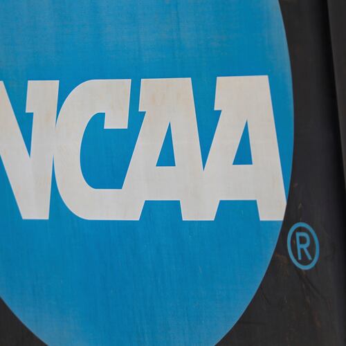 FILE - An NCAA logo displayed on the fence before an NCAA softball game between Jacksonville and FGCU, March 24, 2024, in Jacksonville, Fla. (AP Photo/Gary McCullough, File)