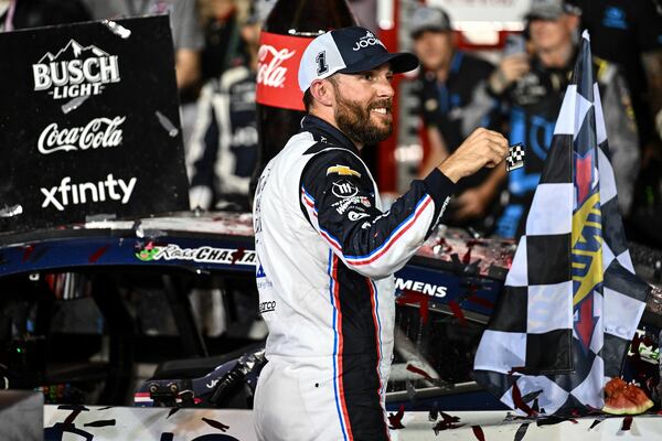 Ross Chastain celebrates in Victory Lane after winning a NASCAR Cup Series auto race at Charlotte Motor Speedway, Sunday, May 25, 2025, in Concord, N.C. (AP Photo/Matt Kelley)