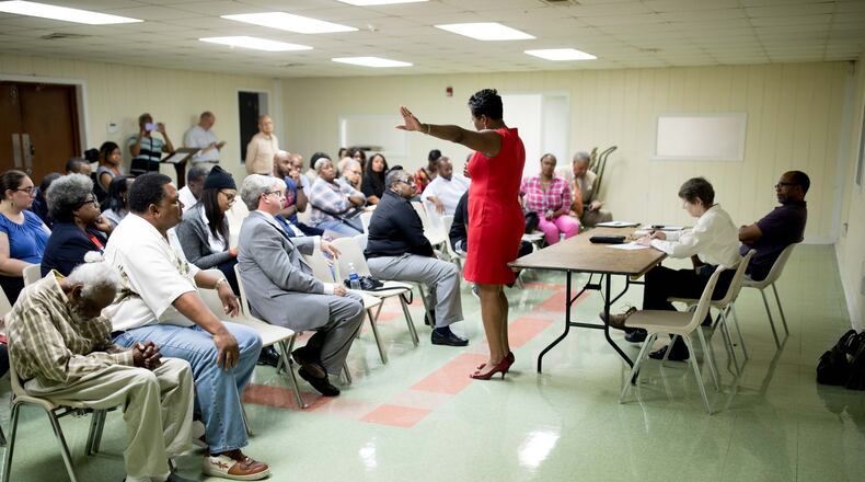 Keisha Waites, who is running for the chair of Fulton County, speaks to a group of people during a candidate forum at the Cliftondale Community Club in College Park, Monday, Oct. 10, 2017, in Atlanta. BRANDEN CAMP/SPECIAL