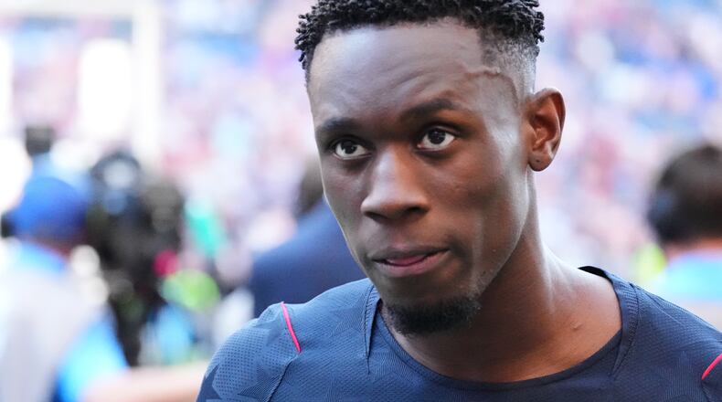FILE - United States' Folarin Balogun (20) walks off the pitch after losing to Belgium in their World Cup round of 16 soccer match in Seattle, on July 6, 2026. (AP Photo/Ted S. Warren, File)
