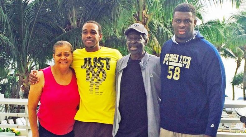Georgia Tech center Freddie Burden (far right) with his family at the Orange Bowl last December: From left, Velma, Willie Jr., Willie Sr. and Freddie. (Courtesy Burden family)