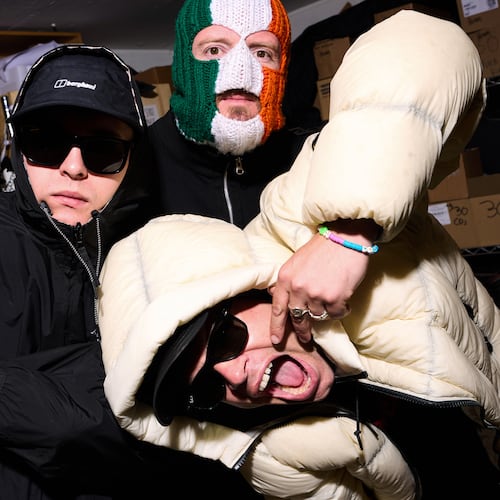 Liam Og O hAnnaidh, aka Mo Chara, from left, J. J. O Dochartaigh, aka DJ Provai and Naoise O Caireallain, aka Moglai Bap, from the band Kneecap pose for portrait photographs on Thursday, April 30, 2026, in London. (Photo by Scott A Garfitt/Invision/AP)