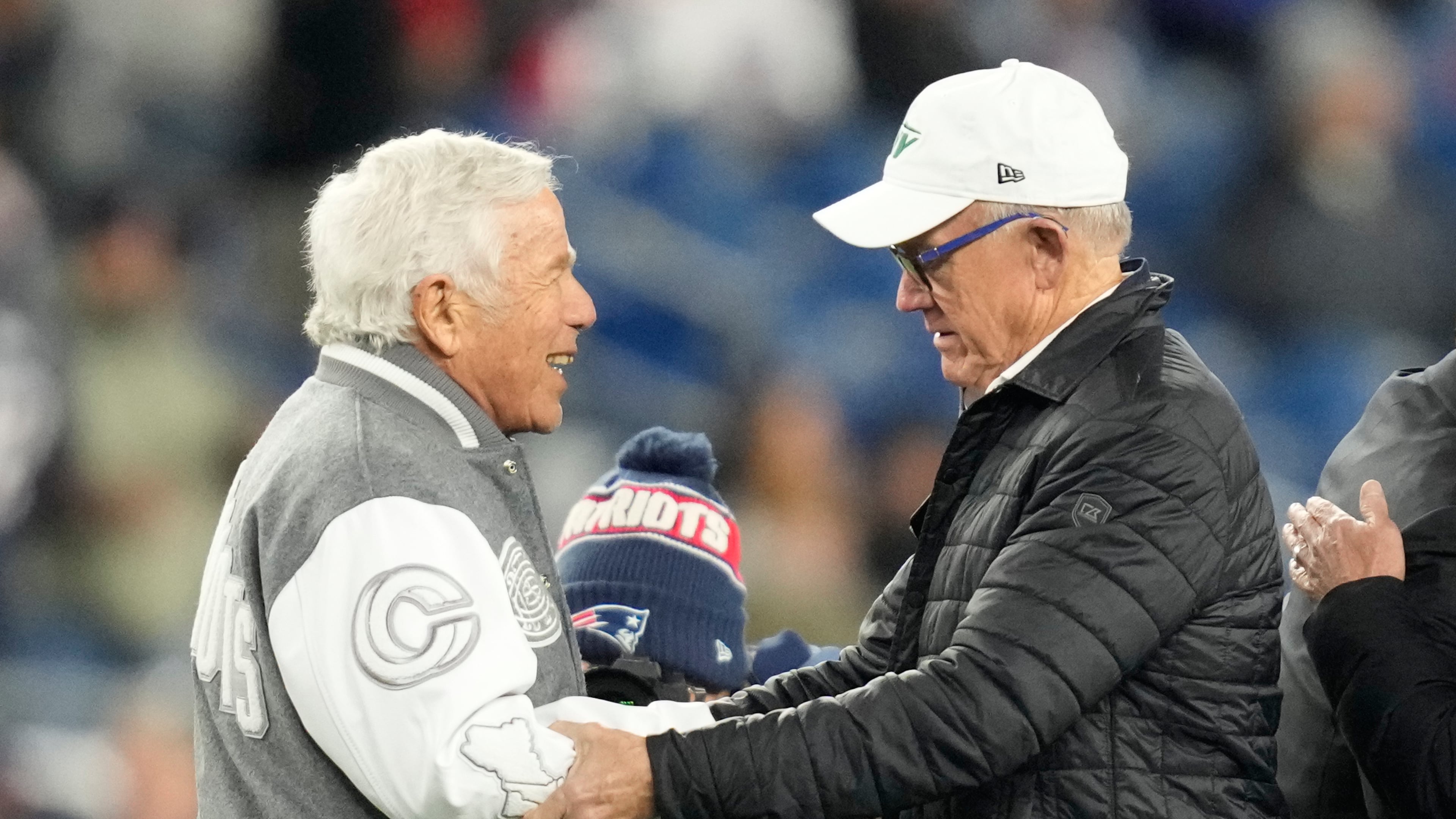 New England Patriots owner Robert Kraft, meets with New York Jets owner Woody Johnson ahead of an NFL football game, Thursday, Nov. 13, 2025, in Foxborough, Mass. (AP Photo/Charles Krupa)