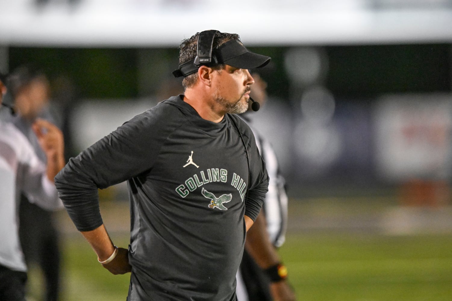Collins Hill head coach Drew Swick watches the Eagles during the first half of play against Grayson Friday, August 15, 2025. (Daniel Varnado for the AJC)