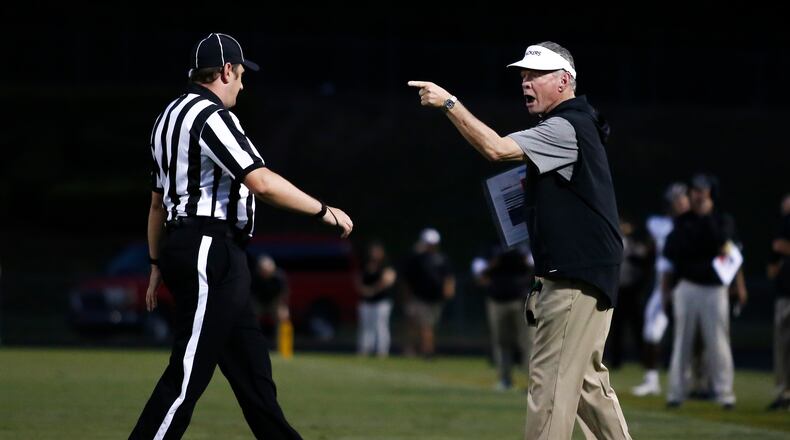Rush Propst (right) disagrees with an official. (Casey Sykes for The Atlanta Journal-Constitution)