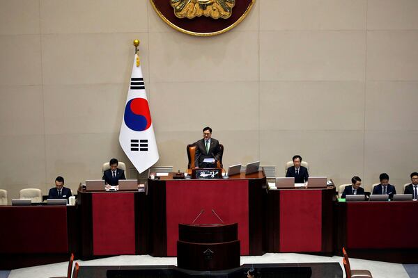 FILE - South Korean National Assembly Speaker Woo Won-shik, center, announces the result of voting for president impeachment during a plenary session of the impeachment vote of President Yoon Suk Yeol at the National Assembly in Seoul, on Dec. 14, 2024. (Woohae Cho/Pool Photo via AP, File)
