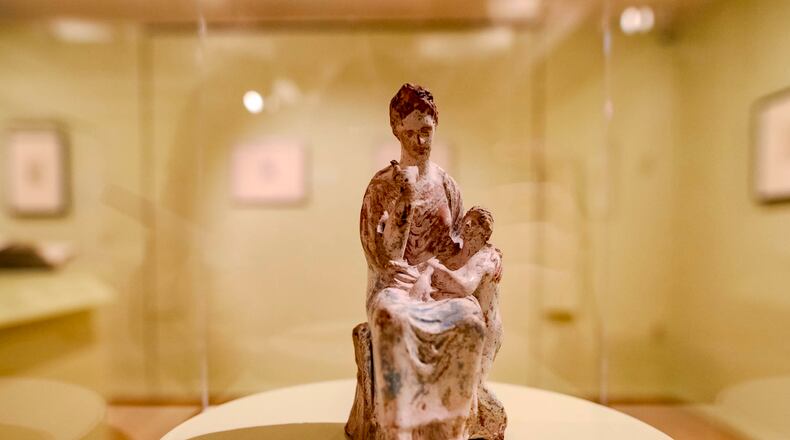 A Tanagra statuette depicting a mother and child on display at the Michael C. Carlos Museum. (Photo Courtesy of Isadora Pennington)