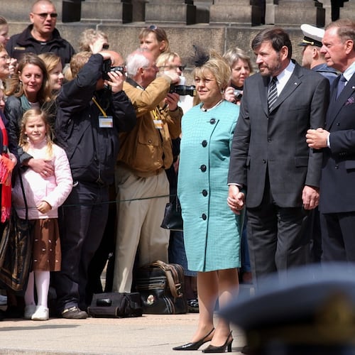 FILE - John Donaldson, center right, father of Mary Donaldson, the fiancée of Denmark’s Crown Prince Frederik, and his wife, Susan Moody, center left, speak to the crowd in front of the Danish Parliament in Copenhagen, May 13, 2004. (AP Photo/Virginia Mayo, File)