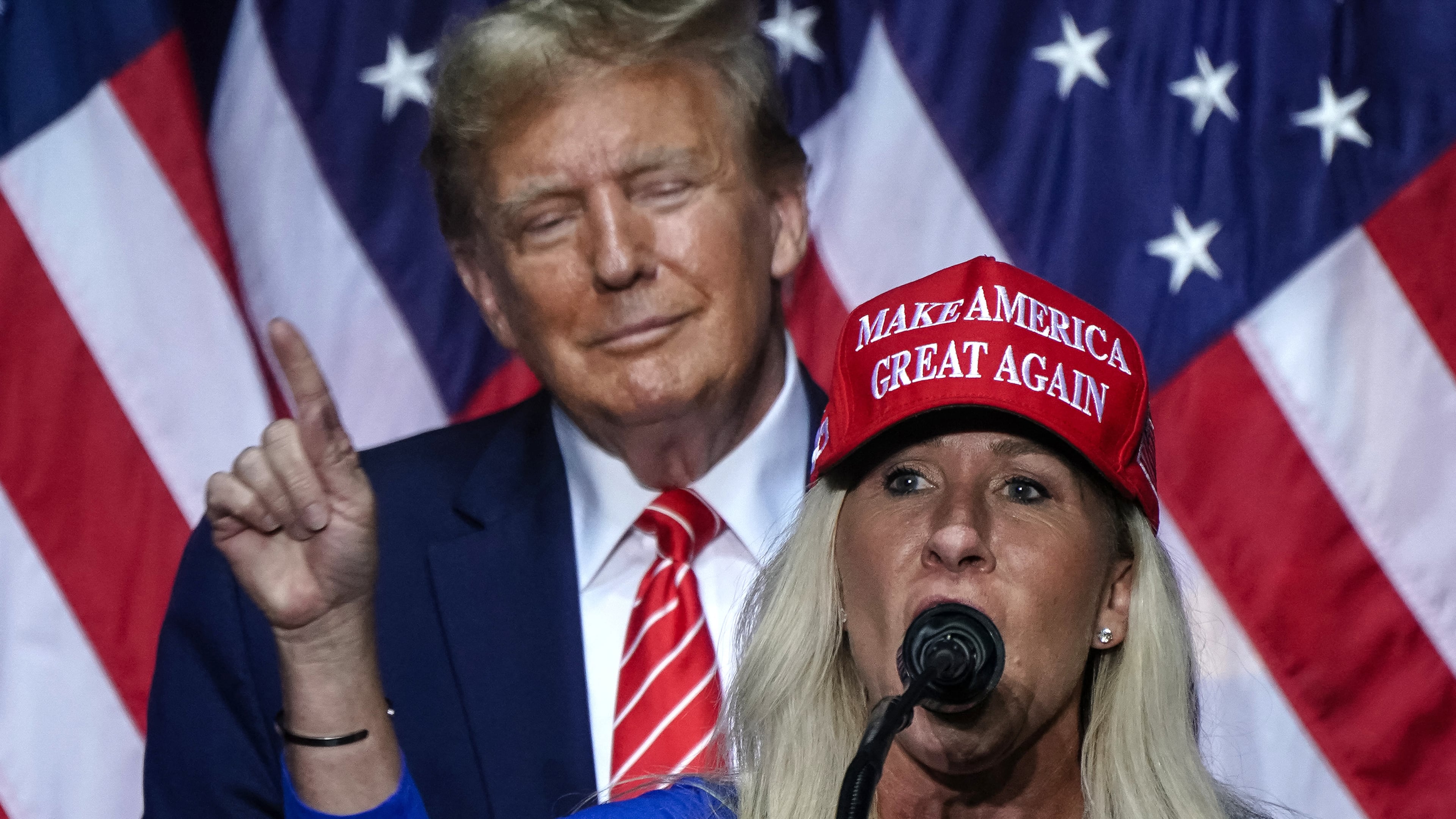 U.S. Rep. Marjorie Taylor Greene (right) speaks alongside President Donald Trump during his campaign event in Rome on March 9, 2024. (Elijah Nouvelage/TNS 2024)