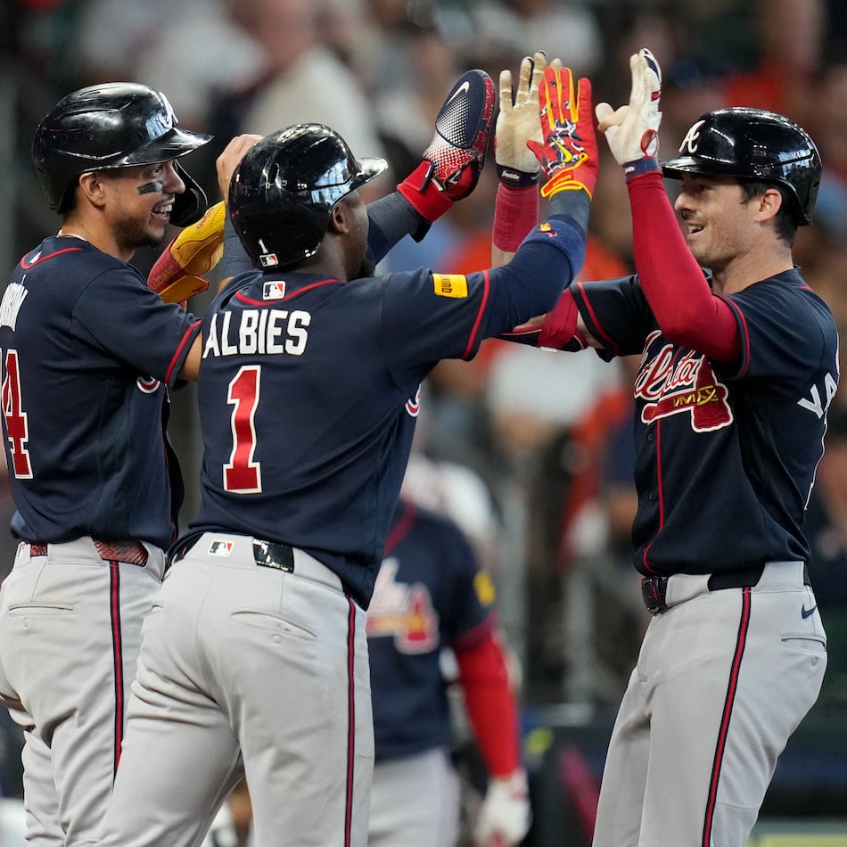 Atlanta Braves' Mike Yastrzemski (right) celebrates after his three-run home run with Mauricio Dubon (left) and Ozzie Albies (center) during the sixth inning of a baseball game against the Houston Astros, Sunday, Sept. 20, 2026, in Houston. (Karen Warren/AP)