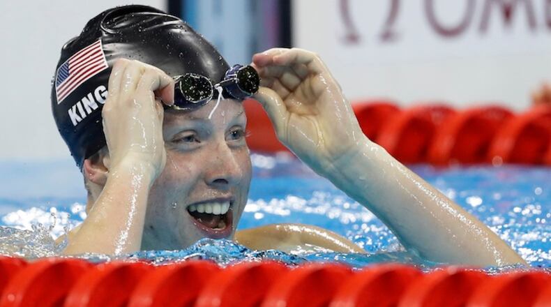 FILE - In this Aug. 8, 2016, file photo, United States' Lilly King celebrates after winning the gold medal in the women's 100-meter breaststroke final at the 2016 Summer Olympics in Rio de Janeiro, Brazil. King became the face of "clean athletes" in Rio. King isn't backing away from that reputation and instead hopes to use her success to send a message to everyone else as she enters her sophomore season at Indiana. (AP Photo/Michael Sohn, File)