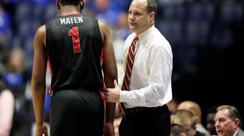 Georgia forward Yante Maten (1) walks to the bench past head coach Mark Fox late in the second half of an NCAA college basketball game between Georgia and Kentucky at the Southeastern Conference tournament Friday, March 10, 2017, in Nashville, Tenn. Kentucky won 71-60. (AP Photo/Wade Payne)
