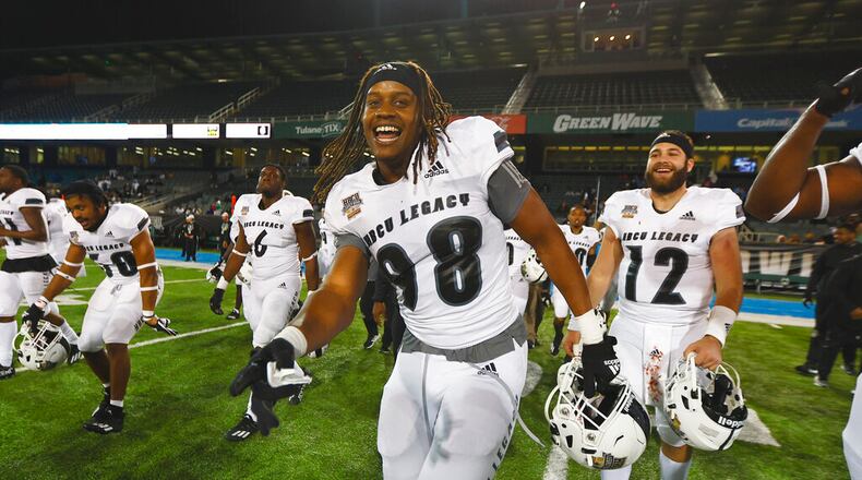 Norfolk State defensive end Christopher Myers (98) and Chowan quarterback Steven "Bryce" Witt (12) celebrate their win on Saturday, Feb. 19, 2022, at the HBCU Legacy Bowl in New Orleans. (Brandon Wade/AP Images for NFL)