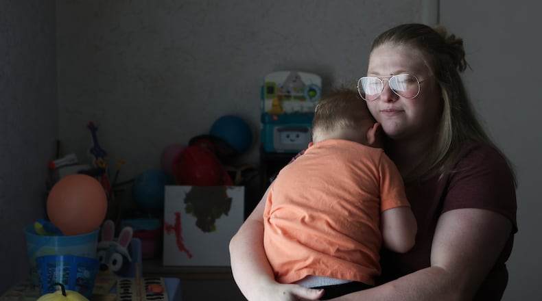 Meygan Maloney poses for a portrait with her son Callum Wilson, 3, Friday, Aug. 28, 2026, at their home in Hartford City, Ind. (AP Photo/Cara Penquite)