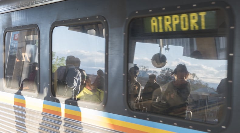 Passengers wait to board the Red Line train at the North Springs MARTA station recently. (DAVID BARNES / DAVID.BARNES@AJC.COM)