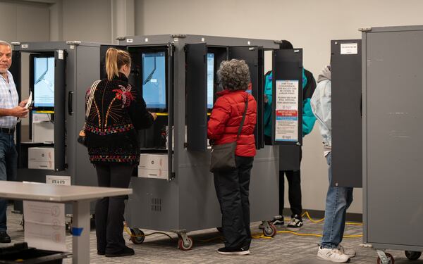 Voters cast their ballots using touchscreens at a Buckhead voting precinct in November. (Ben Hendren for the AJC)