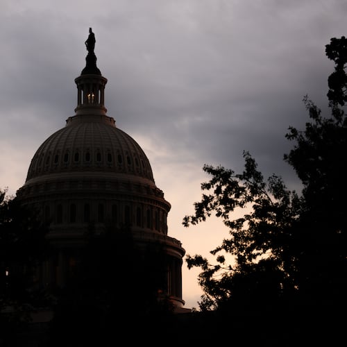 The sun sets behind the U.S. Capitol, Tuesday, July 28, 2026, in Washington. (AP Photo/Allison Robbert)