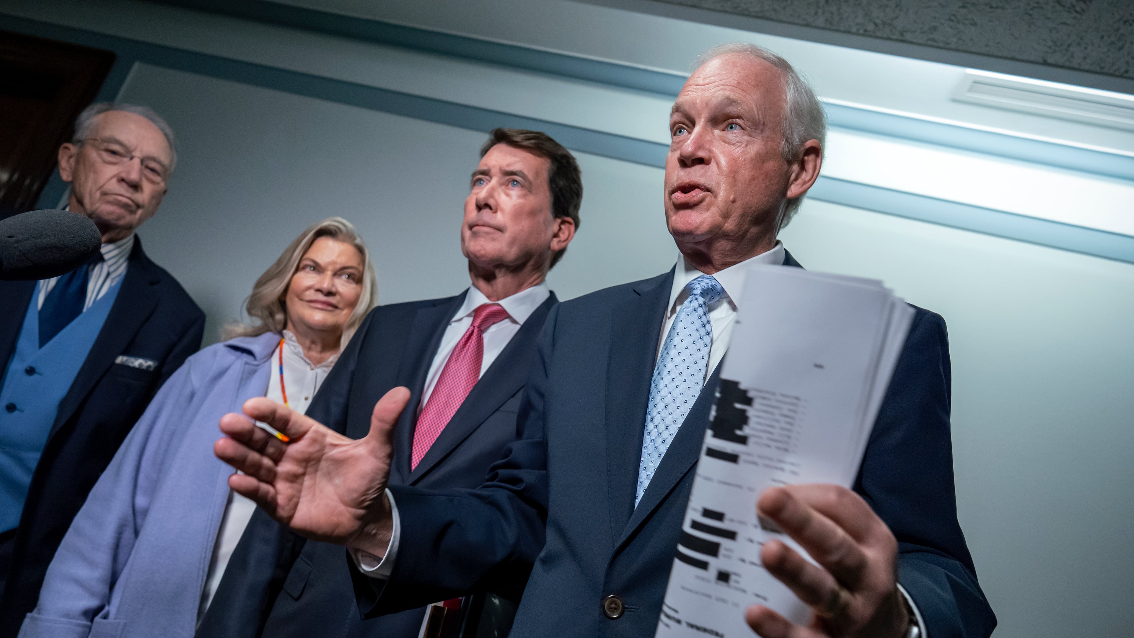 From left, Senate Judiciary Committee Chairman Chuck Grassley, R- Iowa, Sen. Cynthia Lummis, R-Wyo., Sen. Bill Hagerty, R-Tenn., and Sen. Ron Johnson, R-Wis., chairman of the Permanent Subcommittee on Investigations, speak with reporters as they make an announcement about their oversight of the FBI, at the Capitol in Washington, Monday, Oct. 6, 2025. (AP Photo/J. Scott Applewhite)