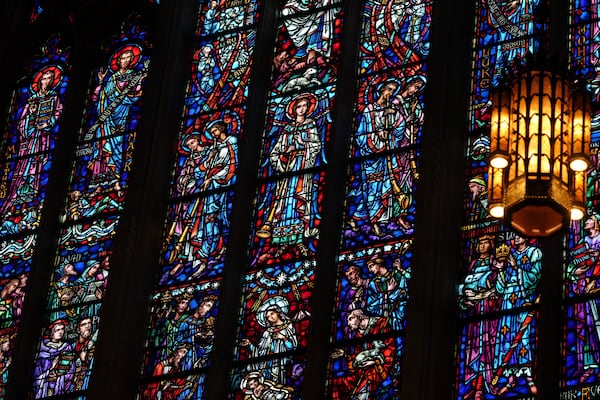 Stained glass windows at the Princeton University chapel are illuminated by sunlight in Princeton, N.J., on Thursday, May 15, 2025. (AP Photo/Luis Andres Henao)
