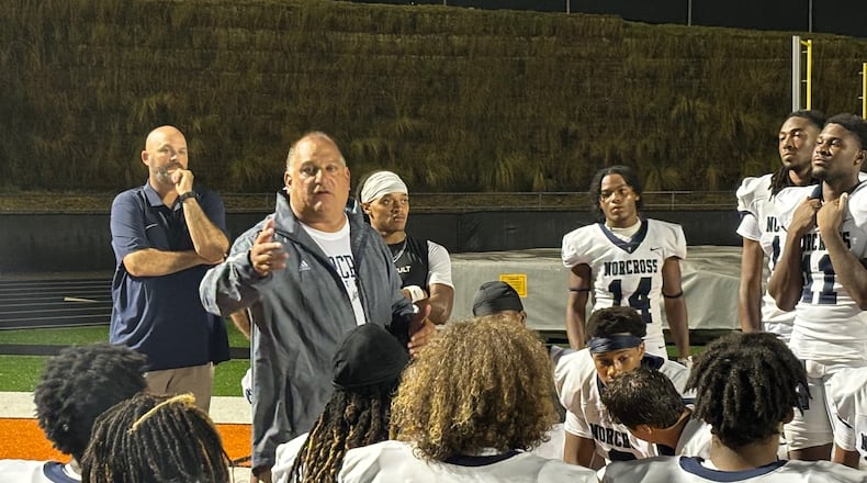 Norcross coach Keith Maloof talks to his team after its 31-10 win over Lanier, Aug. 17, 2024.
