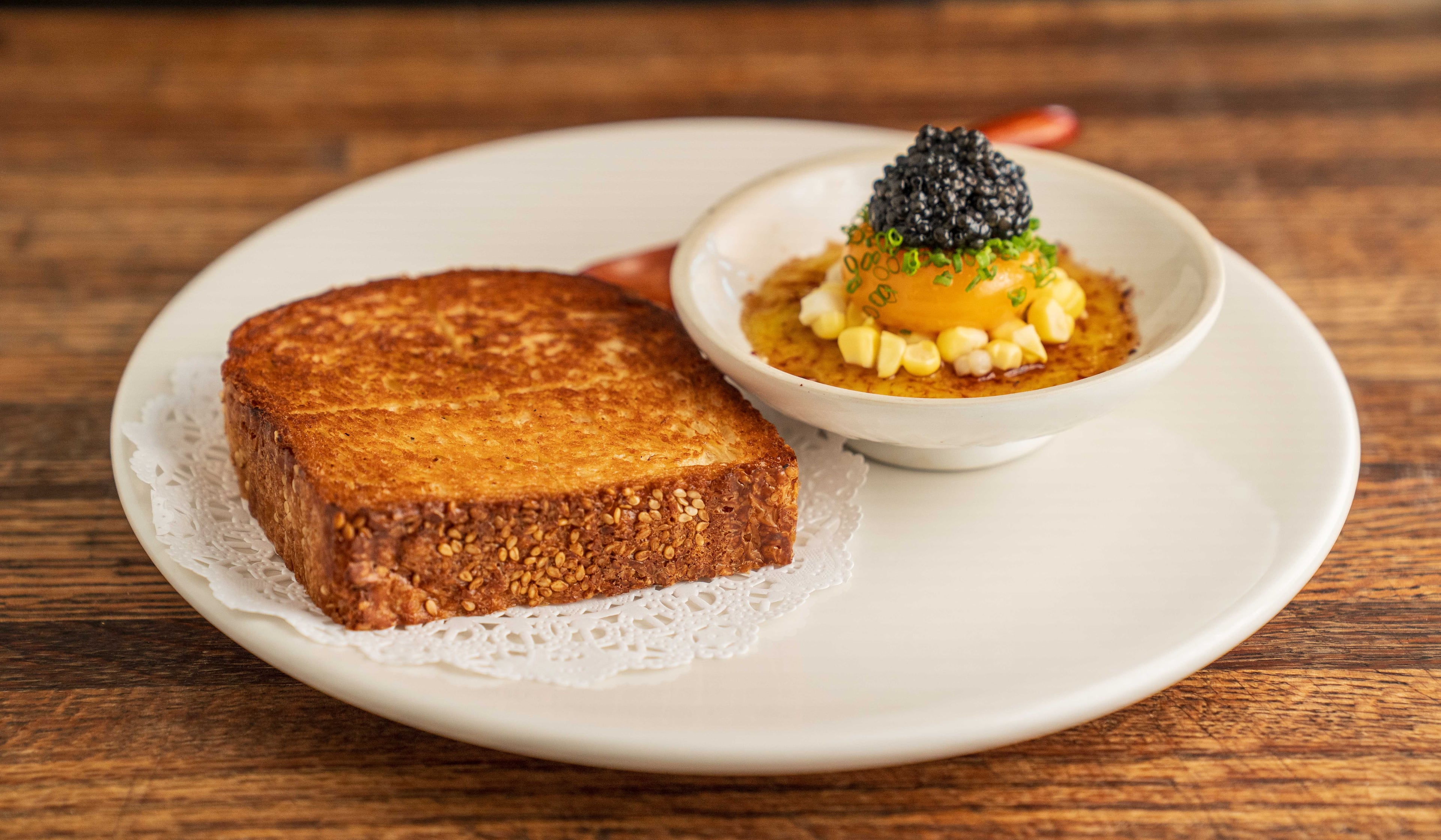 Ossetra caviar with cured egg yolk and toast at Gunshow. (Credit: Blake Studwell, courtesy of Gunshow)