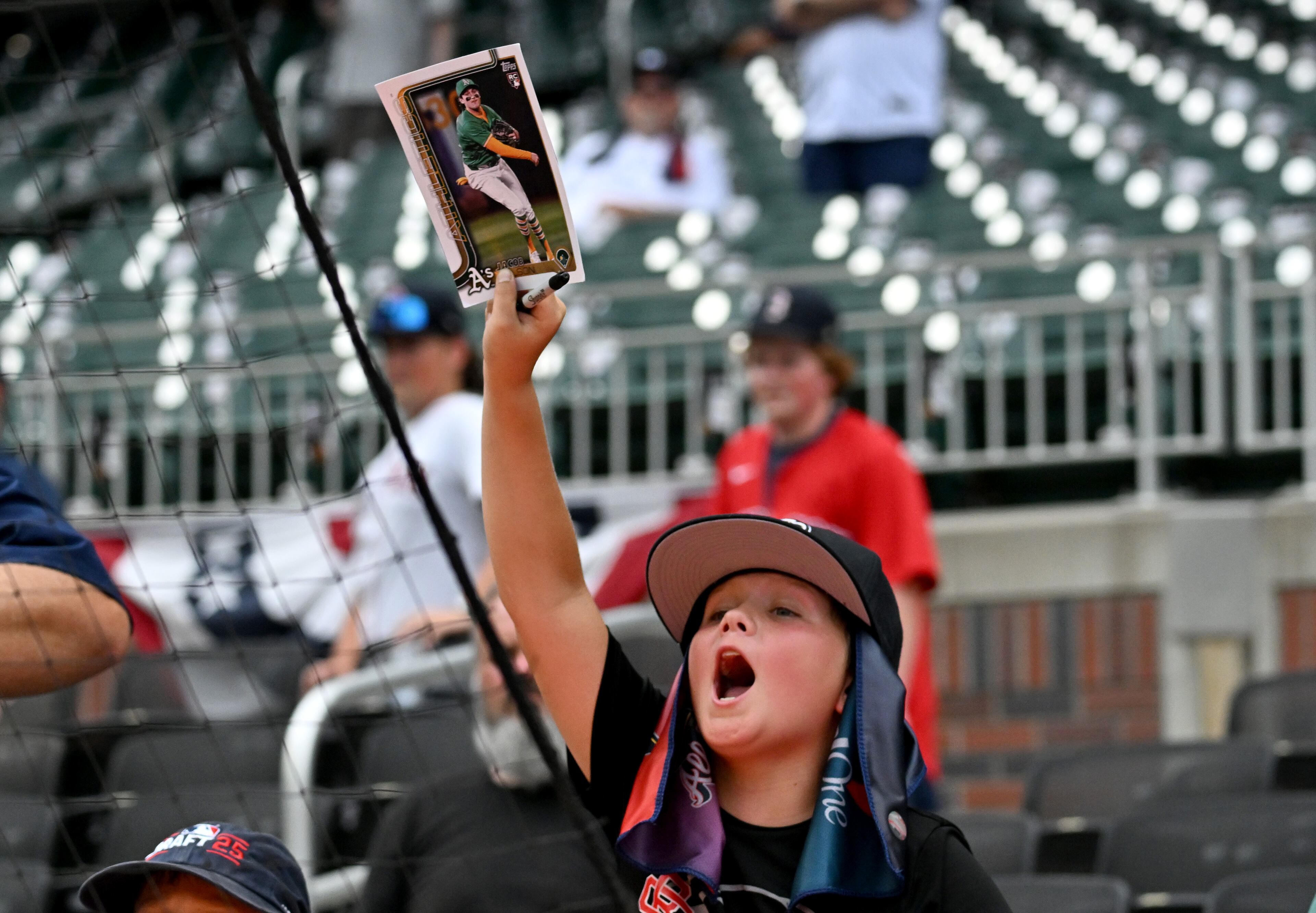 Baseball fans ask for autographs before the 2025 MLB All-Star Game at Truist Park, Tuesday, July 15, 2025, in Atlanta. (Hyosub Shin/AJC)