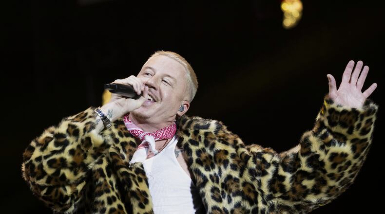 FILE - U.S. rapper Macklemore performs on the Main Stage at the 42th Gurtenfestival edition in Bern, Switzerland, Wednesday, July 16, 2025. (Anthony Anex/Keystone via AP, File)