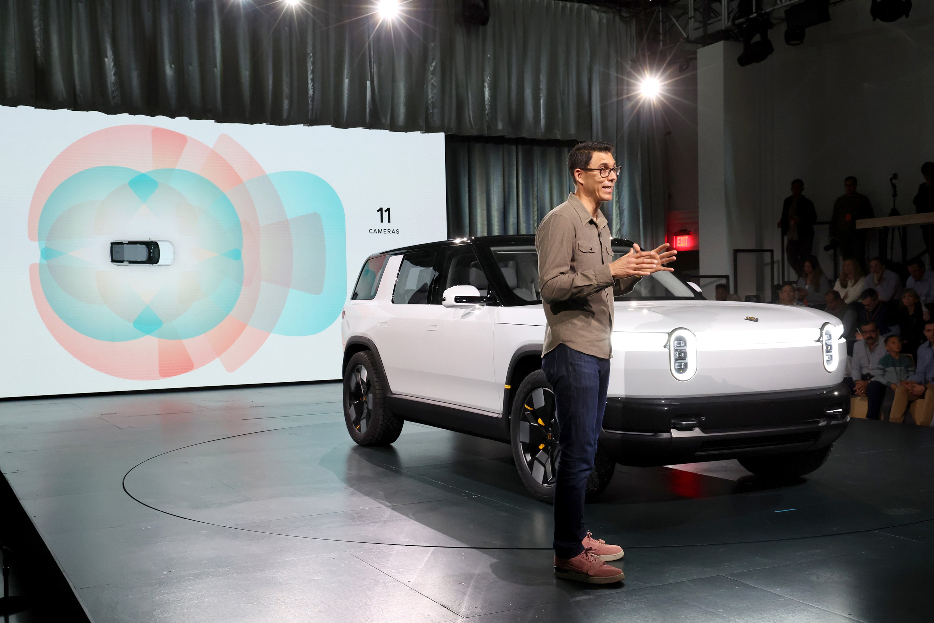 CEO RJ Scaringe speaks during the Rivian Reveals All-Electric R2 Midsize SUV event on March 7, 2024, in Laguna Beach, Calif. Starting at $45,000, the R2 is significantly cheaper than Rivian’s flagship pickup truck and SUV models. (Phillip Faraone/Getty Images for Rivian/TNS)