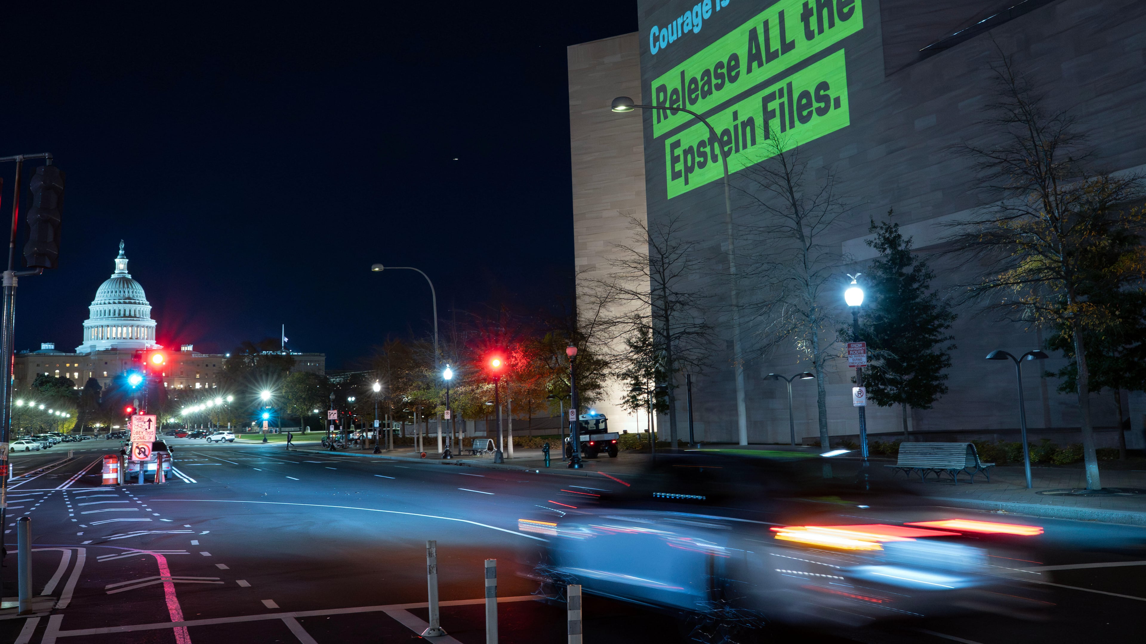 A World Without Exploitation projection is seen on the wall of the National Gallery of Art calling on Congress to vote yes on the Epstein files transparency act in Washington, Monday, Nov. 17, 2025. (AP Photo/Jose Luis Magana)