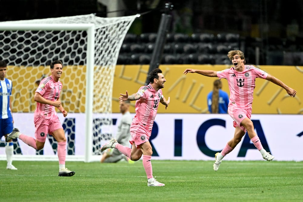 Inter Miami's Lionel Messi (center) celebrates at Mercedes-Benz Stadium. 
