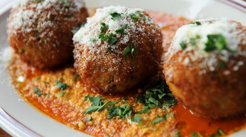 131029-ATLANTA-GA- Jenny Turkett's dine review of Timone's in Morningside on Tuesday October 29, 2013. FOOD: Rice Balls- sweet peas, Berkshire Prociutto & Parmesan. (BECKY STEIN)