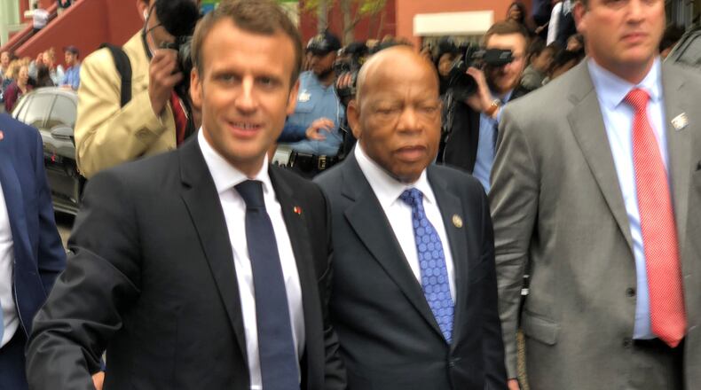 French President Emmanuel Macron, left, and Georgia Congressman John Lewis, center, walk together in Washington D.C., on April 25, 2018. (Photo courtesy of John Lewis' office.)