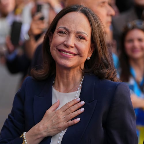Venezuelan opposition leader Maria Corina Machado reacts before receiving the Golden Key of the City of Madrid from Madrid Mayor Jose Luis Martinez-Almeida in Madrid, Spain, Friday, April 17, 2026. (AP Photo/Manu Fernandez)