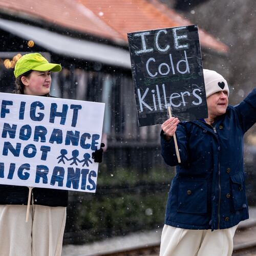 Caroline Campbell (left) and Erin Campbell protest Immigration and Customs Enforcement in Woodstock in January. (Ben Hendren for the AJC 2026)