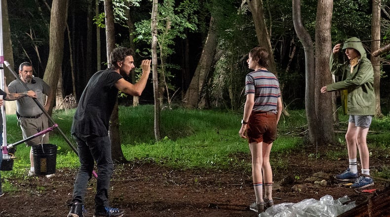 Director Shawn Levy shooting "Stranger Things" actors Noah Schnapp and Finn Wolfhard during season 3. Tina Rowden/Netflix