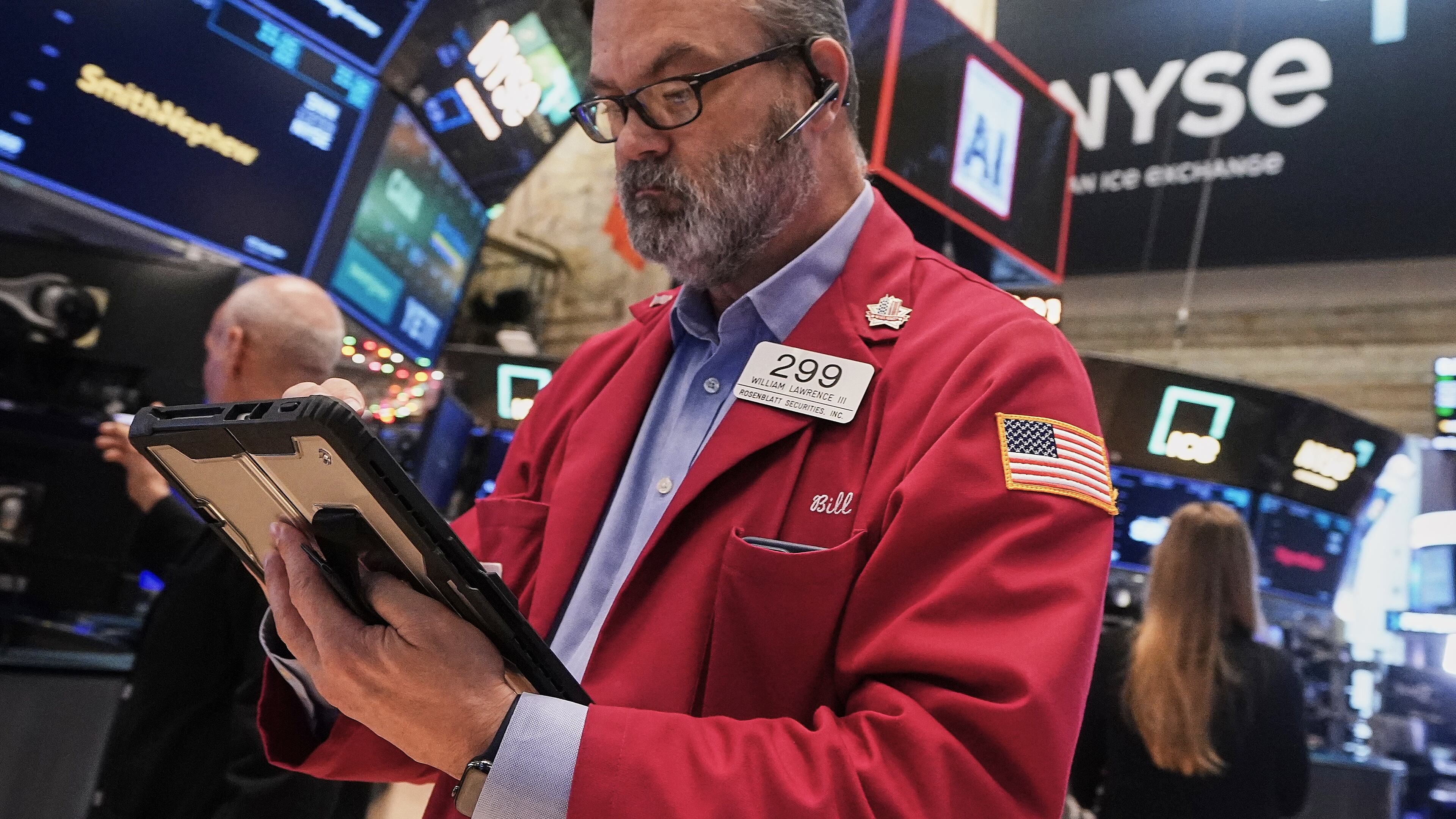 Trader William Lawrence works on the floor of the New York Stock Exchange, Thursday, Dec. 11, 2025. (AP Photo/Richard Drew)